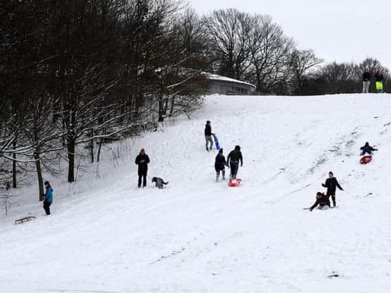 People enjoying the snow in Norfolk Heritage Park, Sheffield, after a wintry blast swept over the UK in March, 2018.