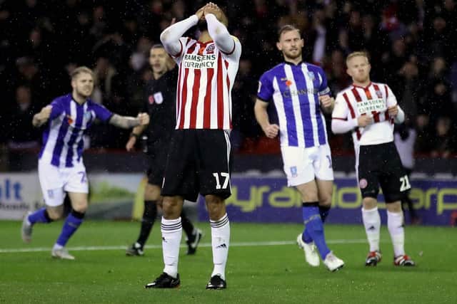 Sheffield United's David McGoldrick reacts after his penalty is saved by Sheffield Wednesday goalkeeper Cameron Dawson: Tim Goode/PA Wire.