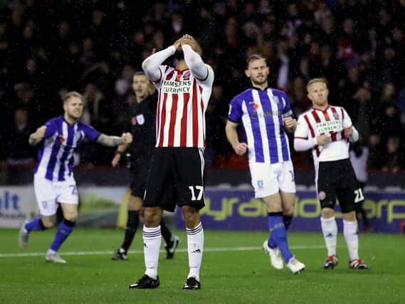 Sheffield United's David McGoldrick reacts after his penalty is saved by Sheffield Wednesday goalkeeper Cameron Dawson: Tim Goode/PA Wire.