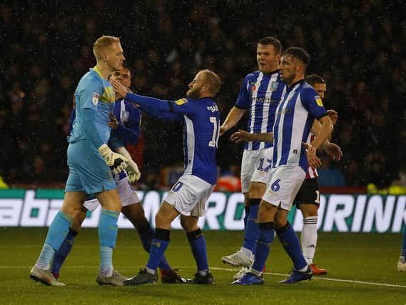 Cameron Dawson of Sheffield Wednesday is congratulated after saving a penalty.