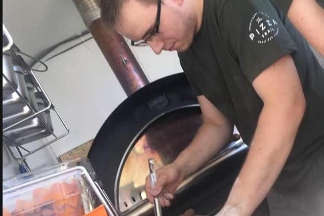 Oliver Ellis with his pizza oven, which is built in a converted horse box