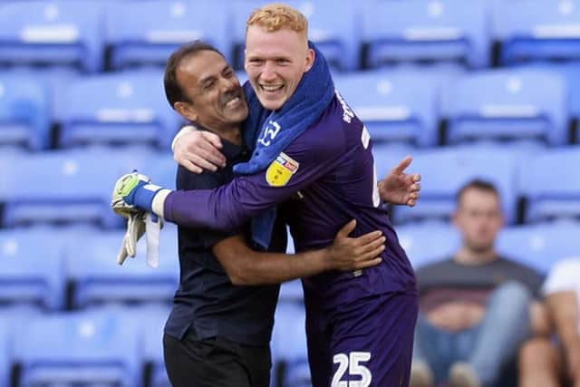 Luhukay celebrating with Cameron Dawson after Wednesday's win at Reading