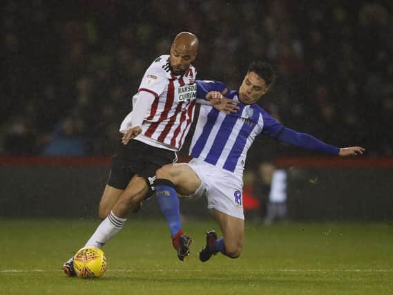 David McGoldrick of Sheffield Utd tackled by Joey Pelupessy of Sheffield Wednesday during the Sky Bet Championship match at Bramall Lane Stadium, Sheffield. Picture date 09th November 2018. Picture credit should read: Simon Bellis/Sportimage
