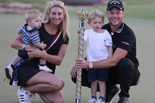 Danny Willett, his wife Nicole and their children pose with the trophy after he won the DP World Tour Championship golf tournament in Dubai, United Arab Emirates, Sunday, Nov. 18, 2018. (AP Photo/Kamran Jebreili)