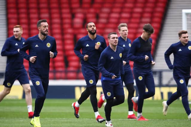 Scotland's Steven Fletcher (second left), John Fleck (centre) and James Forrest (right) work-out ahead of the Israel clash: Jane Barlow/PA Wire. EDITORIAL USE ONLY