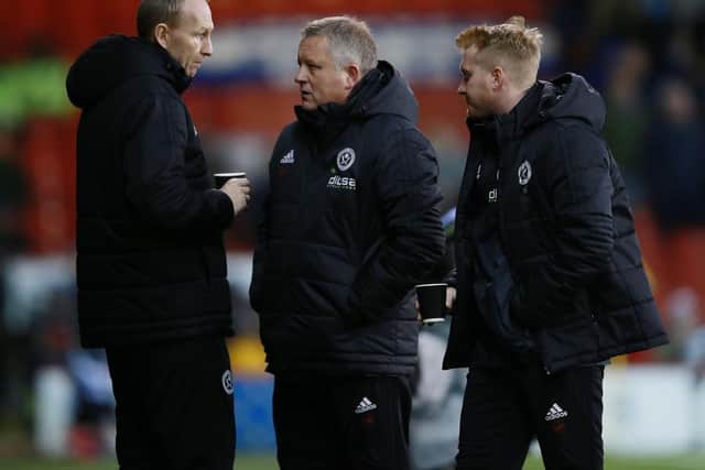 Sheffield United manager Chris Wilder (centre), Alan Knill and Matt Prestridge have discussed their transfer options
