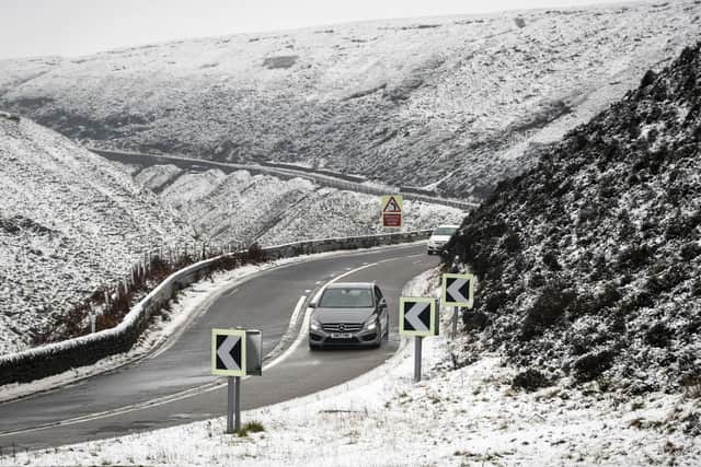 A car navigates the Snake Pass in Derbyshire, as a blast of snow hits the north of England. Picture: Danny Lawson/PA Wire