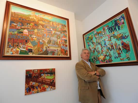 Joe Scarborough with some of his paintings in 2009.