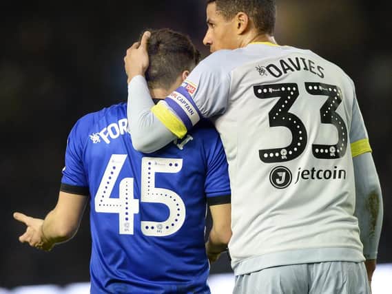 Fernando Forestieri is consoled by Derby's Curtis Davies.