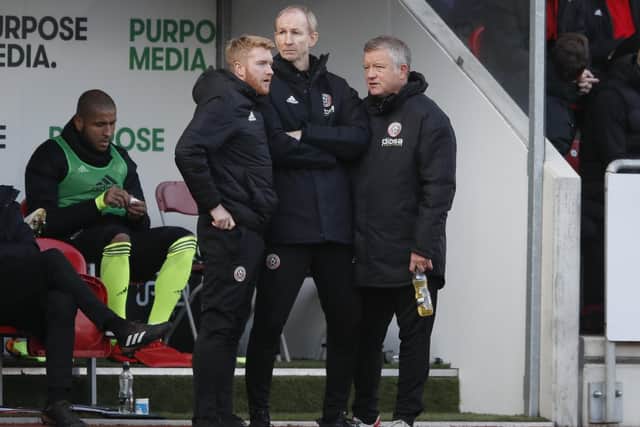 Matt Prestridge, Alan Knill and Chris Wilder manager of Sheffield during the Sky Bet Championship match at the Aesseal New York Stadium: Simon Bellis/Sportimage