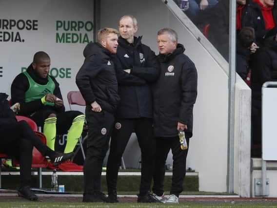 Matt Prestridge, Alan Knill and Chris Wilder manager of Sheffield during the Sky Bet Championship match at the Aesseal New York Stadium: Simon Bellis/Sportimage