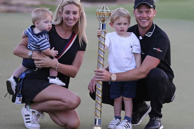 Danny Willett celebrates his win in Dubai with wife Nicole and sons Zachariah and Noah