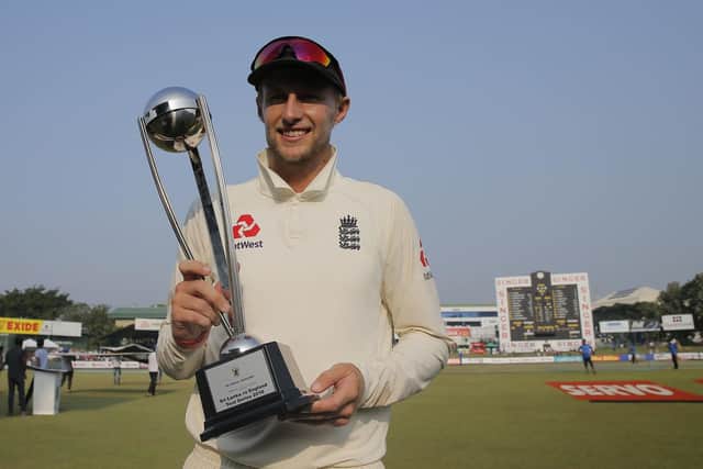 England cricket team captain Joe Root poses with the trophy after the third test cricket match between Sri Lanka and England in Colombo, Sri Lanka, Monday, Nov. 26, 2018. (AP Photo/Eranga Jayawardena)