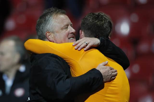 Chris Wilder hugs Dean Henderson after victory at Brentford: David Klein/Sportimage