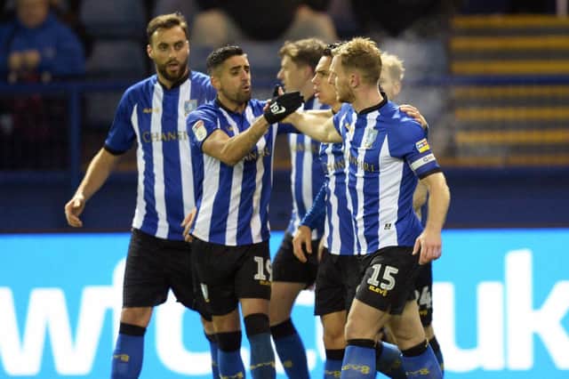 Owls skipper Tom Lees is congratulated for scoring the winner against Bolton