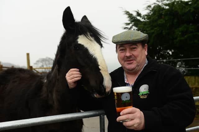 10 March 2015......CW Bradfield Brewery,  Watt House Farm, Sheffield. John Gill  and 11 month old Shire horse foal ' Decade'. Picture Scott Merrylees