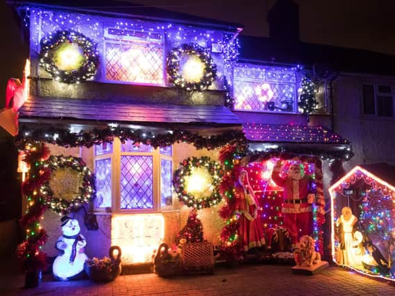 A house adorned with Christmas lights and decorations