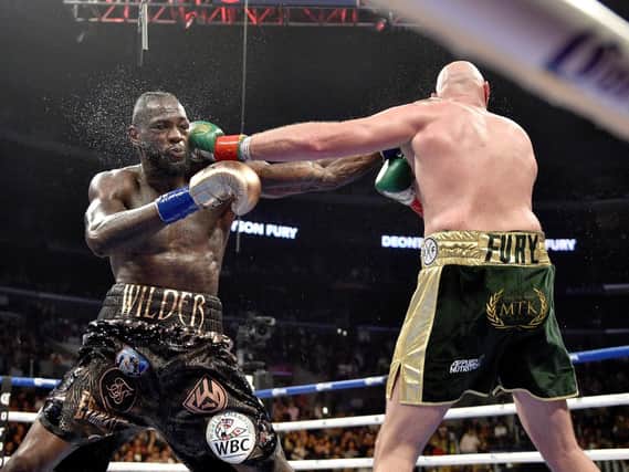 Deontay Wilder and Tyson Fury during the WBC Heavyweight Championship bout at the Staples Center in Los Angeles. Pic: Lionel Hahn/PA Wire