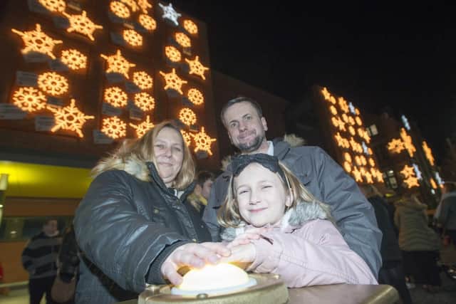 Sheffield Children's Hospital lights switch on by school winner Kendra Theaker-Gregersen with mum Krista and dad Kevin.