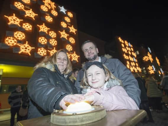 Sheffield Children's Hospital lights switch on by school winner Kendra Theaker-Gregersen with mum Krista and dad Kevin.