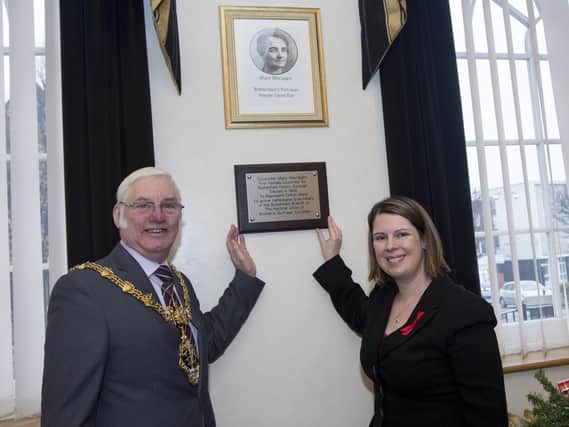 The Mayor of Rotherham Coun Alan Buckey and Coun Emma Hoddinott, Cabinet Member for Waste, Roads and Community Safety with the plaque commerating Rotherham's first female councillor, Mary Maclagan at Rotherham Town Hall