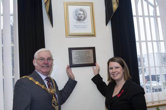 The Mayor of Rotherham Coun Alan Buckey and Coun Emma Hoddinott, Cabinet Member for Waste, Roads and Community Safety with the plaque commerating Rotherham's first female councillor, Mary Maclagan at Rotherham Town Hall