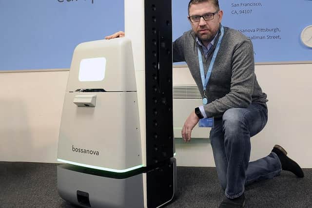 Red McKay, MD of Bossanovas European operations, with a robot in the Sheffield office. Pic Steve Ellis
