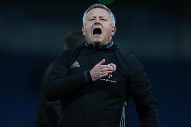 Chris Wilder beating the Sheffield United badge on his chest is the cover image of 'He's one of our own', the story of his Blades revolution
