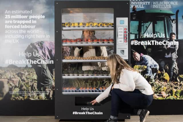 Human Rights Day is being highlighted by students symbolically confined in a 'human vending machine'