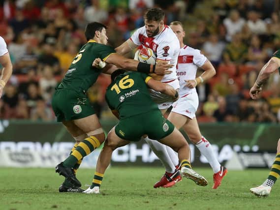 England's Alex Walmsley is tackled during the Rugby League World Cup final between Australia and England, Suncorp Stadium, Brisbane, Australia, December 2, 2017. Picture: Tertius Pickard