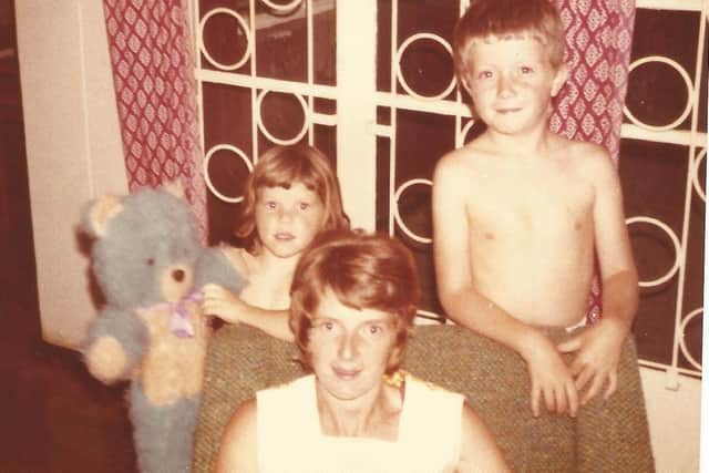 John C Fowler, his mum and sister Andrea in the lounge of their first home in  Zambia