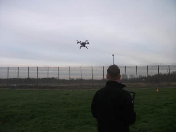 A police drone was used to help search the perimeter fence around HMP Lindholme