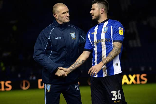 Owls Coach Lee Bullen shakes hands with Daniel Pudil at the final whistle......Pic Steve Ellis