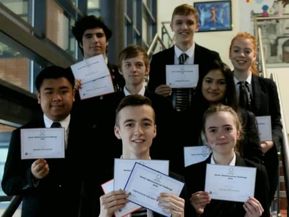 Thirty students from Trinity Academy have taken part in a contest organised byThe UK Mathematics Trust (UKMT), a charity whichaimsto advance the education of young people in mathematics. Pictured with their certificates are: back row (L-R), Mazen Hamdi (silver), Samuel Oxpring (bronze), Jasmine Wood (bronze); middle row, Erick Daleon (bronze), Luke Randall (bronze) and Tharmisha Ramamoorthy (silver); front, Jay Green (silver) and Olivia Jenkins (silver).