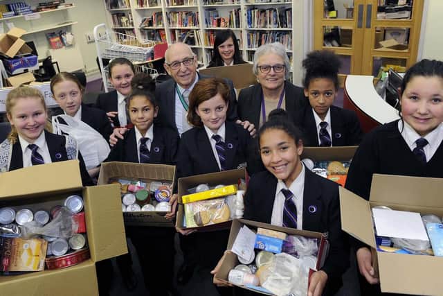 Pupils with Christmas hampers for local residents with project organiser academy librarian Marion Milroy and Deputy Lord Mayor of Sheffield Coun Tony Downing