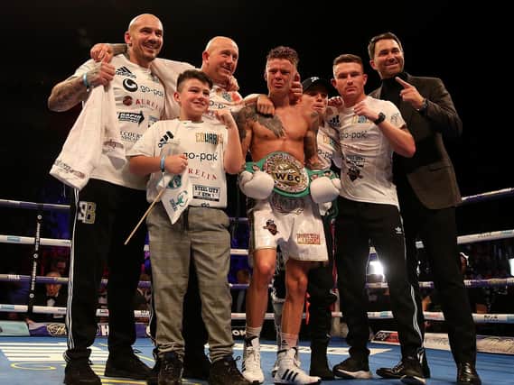 Charlie Edwards celebrates with team after winning the WBC flyweight title