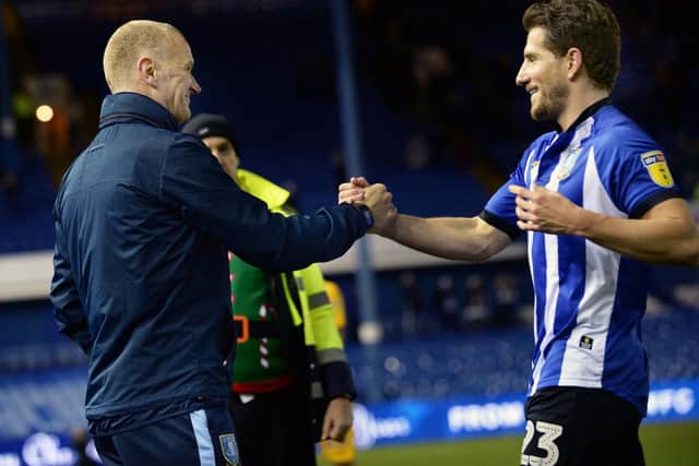Happy Owls caretaker boss Lee Bullen embraces Sam Hutchinson after their victory over Preston