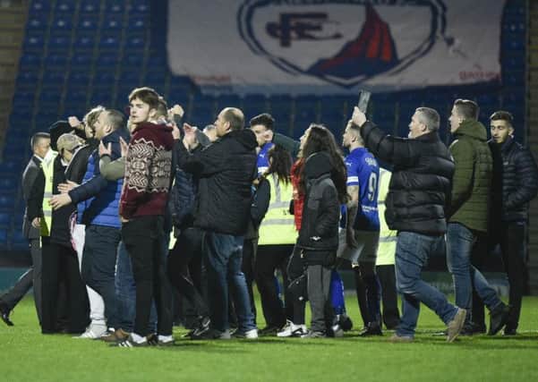 Chesterfield fans invade the pitch in protest against the board. Pic by Steve Flynn.