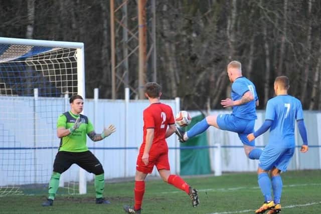 Alec Denton nets for Rossington Main in the derby with Armthorpe Welfare