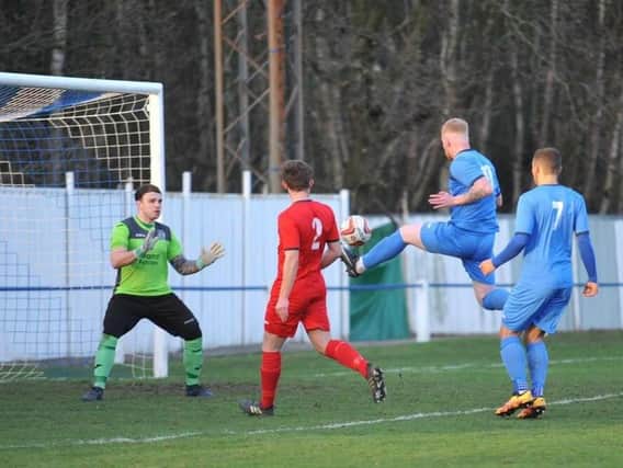 Alec Denton nets for Rossington Main in the derby with Armthorpe Welfare