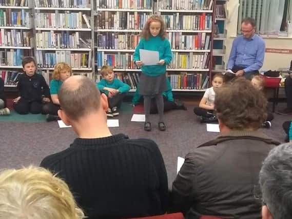 Pupils from Nook Lane Junior School perform their poetry in Stannington Library