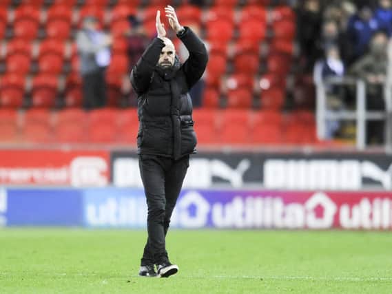 Rotherham's manager Paul Warne salutes the fans after their first win in 9 matches