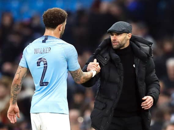 Rotherham United manager Paul Warne shakes hands with Manchester City's Kyle Walker after the Emirates FA Cup, third round match at the Eithad Stadium, Manchester.  Martin Rickett/PA Wire