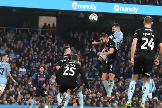 Manchester City's Nicolas Otamendi (second right) scores his side's sixth goal of the game during the Emirates FA Cup, third round match at the Eithad Stadium, Manchester. Martin Rickett/PA Wire