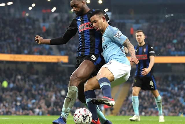 Rotherham United's Semi Ajayi (left) and Manchester City's Gabriel Jesus battle for the ball during the Emirates FA Cup, third round match at the Eithad Stadium, Manchester. Martin Rickett/PA Wire