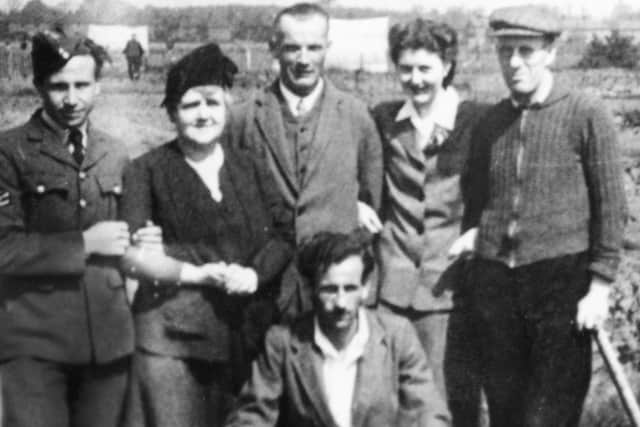 Kay Baker and her parents visiting war casualties who were housed in huts in the infirmary grounds