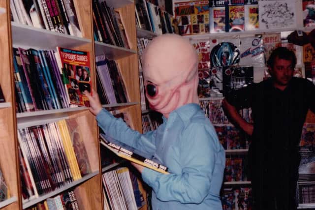 A visitor from outer space? No, a cosplayer costume enthusiast browsing at Sheffield Space Centre  in 1981