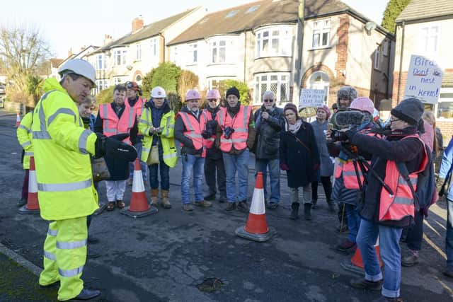 Workers from Amey prepare the road around a tree on Chatsworth Road in sheffield for remedial work
Nick Hetherington explains the course of work that will be carried out to STAG members