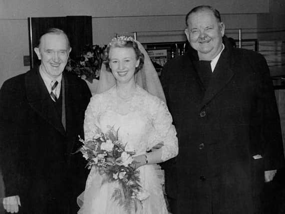 Iconic comedy duo Laurel and Hardy witn a bride at the former Sheffield Grand Hotel in March 1954.