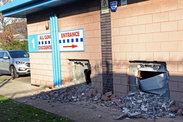 Thieves smashed two holes in the wall of the shop.